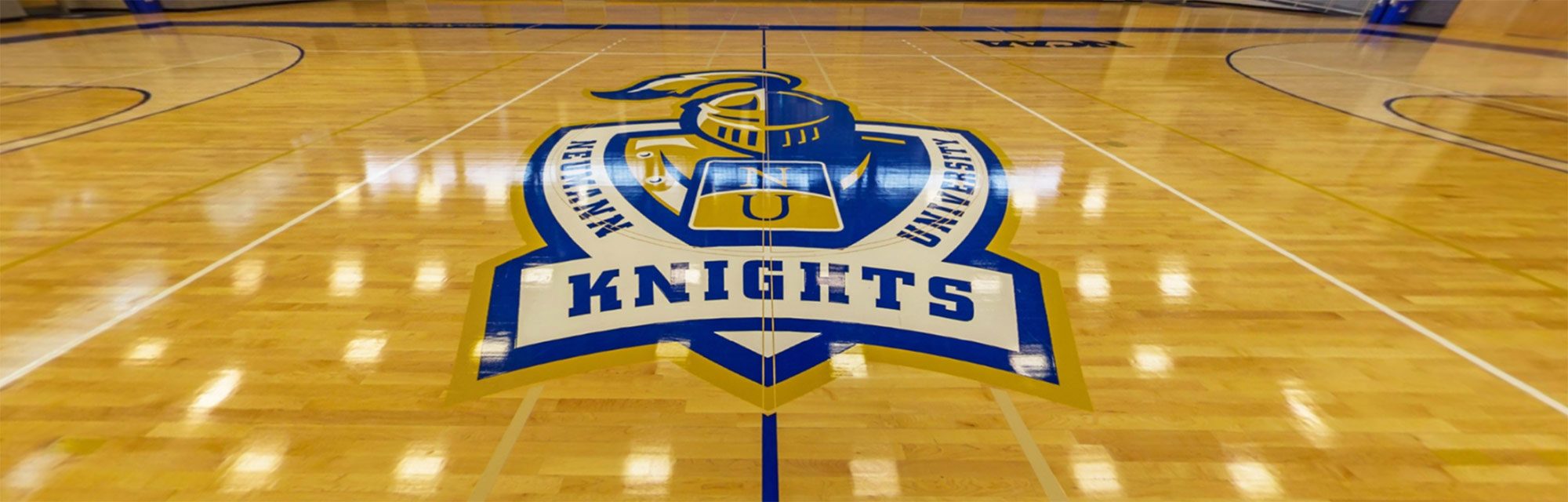 Neumann University logo on the gym floor